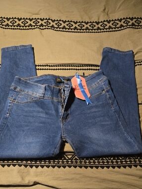 Jordan Pink Tag with Blue Ribbon on Dark Denim
